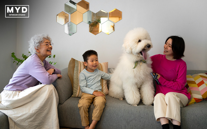 Family and dog on couch in stylish MYD interior.
